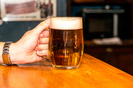Man holding a beerの写真素材