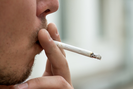 Man smoking cigaretteの写真素材