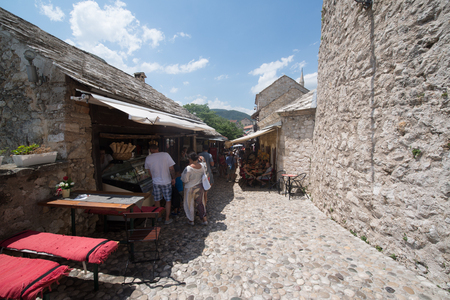 MOSTAR, BOSNIA AND HERZEGOVINA - Circa july 2016: Tourist and locals walking on on streets of the town of Mostar. Included to the UNESCO heritageのeditorial素材
