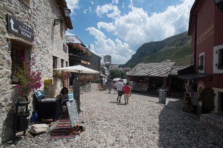 MOSTAR, BOSNIA AND HERZEGOVINA - Circa july 2016: Tourist and locals walking on on streets of the town of Mostar. Included to the UNESCO heritageのeditorial素材