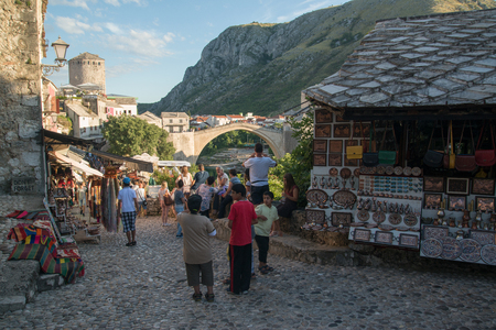 MOSTAR, BOSNIA AND HERZEGOVINA - Circa july 2016: Tourist and locals walking on on streets of the town of Mostar. Included to the UNESCO heritageのeditorial素材