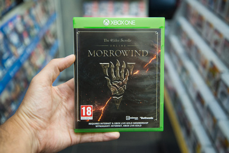 Bratislava, Slovakia, circa april 2017: Man holding The Elder Scrolls online Morrowind videogame on Microsoft XBOX One console in storeのeditorial素材