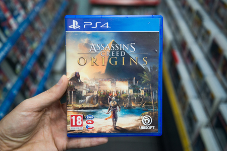 Bratislava, Slovakia, november 3, 2017: Man holding Assassin's creed Origins videogame on Sony...