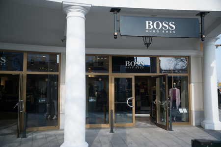 Parndorf, Austria, february 15, 2018: Hugo Boss store in Parndorf, Austria. Hugo Boss  is a German luxury fashion house. It was founded in 1924 by Hugo Boss and is headquartered in Metzingen, Germany.のeditorial素材