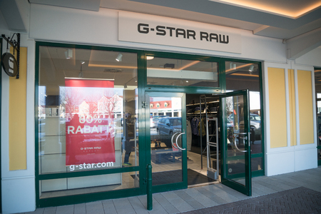 Parndorf, Austria, february 15, 2018: G-Star Raw store in Parndorf, Austria. is a Dutch designer clothing company, founded by Jos van Tilburg in Amsterdam in 1989, which produces urban clothing.のeditorial素材