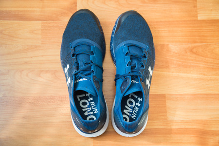 Nitra, Slovakia, february 22, 2018: Blue Under armour shoes model bandit 2 on wooden backgroundのeditorial素材