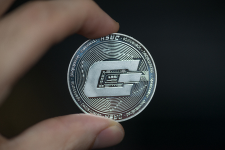 Dash cryptocurrency coin on mirror backgroundの写真素材