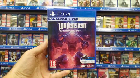 Bratislava, Slovakia, July 23, 2019: Man holding Wolfenstein Cyberpilot VR videogame on Sony...