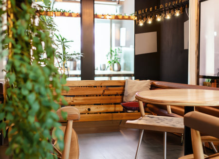 Indoor interior cozy luxury retro wooden cafe coffee shop with plants. with copy spaceの素材