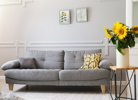 Dark living room interior with dinner table and chairs, side view tv zone with sofa and sideboard with decoration. Panoramic windowの素材