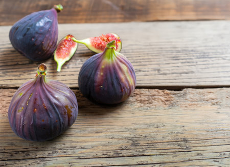 A few figs on an old wooden background with copy space.の素材
