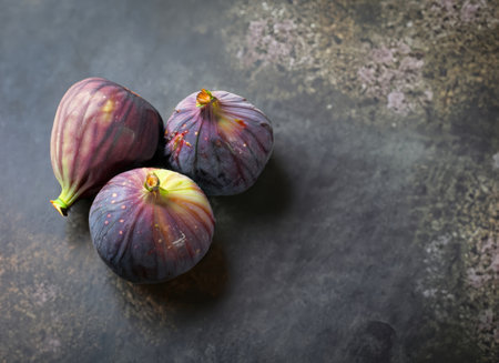 A few figs on an old cement background with copy space.の素材
