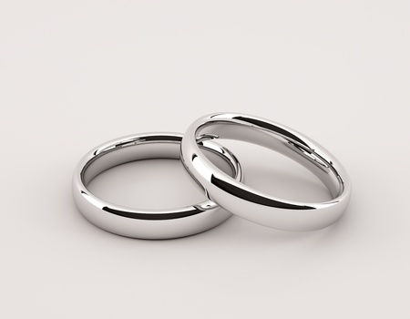 Two silver rings for wedding or engagement on the grey backgroundの写真素材