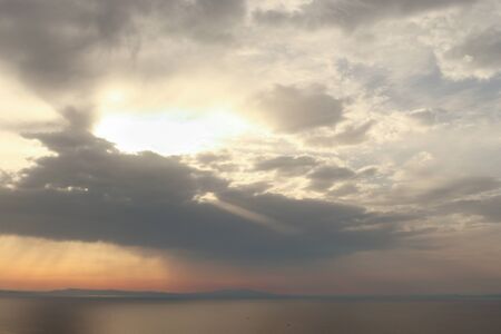 Cloudy summer sunset towards Lesvos in Izmir Dikili TURKEYの写真素材