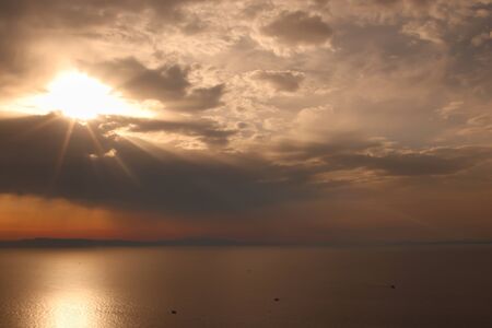 Cloudy sunset towards Lesvos in Izmir Dikili TURKEYの写真素材