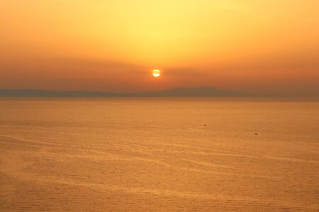 Sunset sea towards Lesvos in Izmir Dikili TURKEYの写真素材