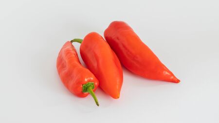 Organic and fresh (CAPIA) red peppers on white backgroundの写真素材