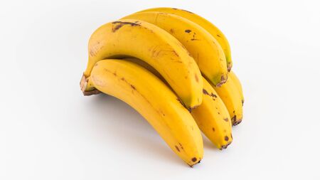 Yellow and organic ripe bananas on white backgroundの写真素材