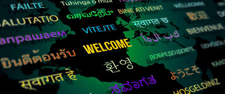 Welcome in different language with world map background. Depth of field image. Words cloud concept.の写真素材