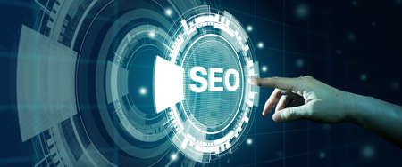 SEO Search Engine Optimization. Man finger touching SEO Hologram. Digital online marketing, Digital marketing media, and Internet technology Concept.の写真素材