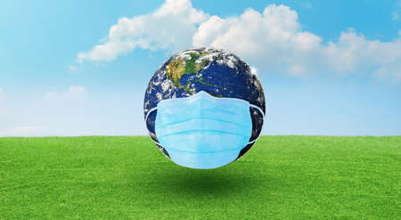 Earth wearing a surgeon mask to fightの写真素材