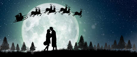 Silhouette of Santa Claus get a move to ride on their reindeer over full moon at night Christmas. Enjoying couple dancing under the full moon.の写真素材
