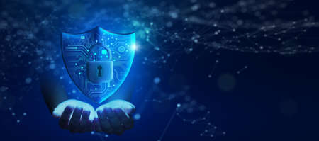 Business Hand holding Shield with Padlock icon and Network wireframe over blue background abstract. Cyber attack block, Cyber data, and Information privacy Concept.の写真素材