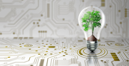 Tree with soil growing on Light bulb. Digital Convergence and and Technology Convergence. Blue light and network background. Green Computing, Green Technology, Green IT, csr, and IT ethics Concept.の写真素材