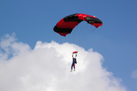 PRACHUAPKHIRIKHAN THAILAND - January 9, 2016: Skydiving show on Children's Day on JAN 9, 2016 in PRACHUAPKHIRIKHAN, THAILAND.のeditorial素材