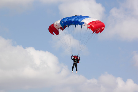 PRACHUAPKHIRIKHAN THAILAND - January 9, 2016: Skydiving show on Children's Day on JAN 9, 2016 in PRACHUAPKHIRIKHAN, THAILAND.のeditorial素材