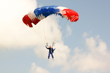PRACHUAPKHIRIKHAN THAILAND - January 9, 2016: Skydiving show on Children's Day on JAN 9, 2016 in PRACHUAPKHIRIKHAN, THAILAND.のeditorial素材