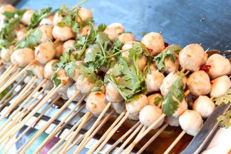 pork meat ball grill. Thai snack on stainless tray sale at food street