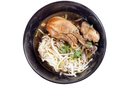 Noodle with chicken in black bowl. Isolated on white with clipping path.