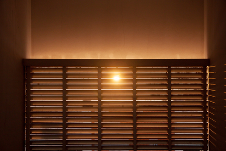 Sun shining through the wooden boardsの写真素材