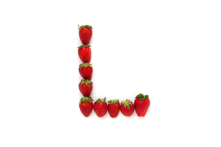 Alphabet L , letter from group of strawberries are arranged. Top view. Isolated on white background...