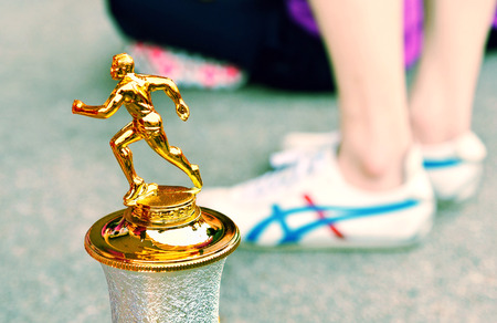 Trophy Close Up, Out Focus of Legs While Standing.のeditorial素材
