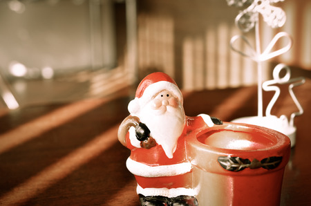 Indoor  background with cute toy Santa Claus.の写真素材