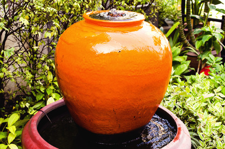Close up of fountain jar. Home garden background (decor, fountain.. home)の写真素材