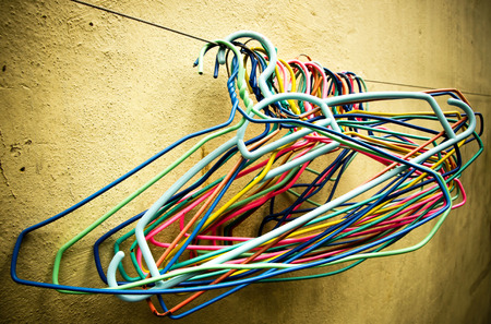 Close up of old clothes hangers in the sunlightの写真素材