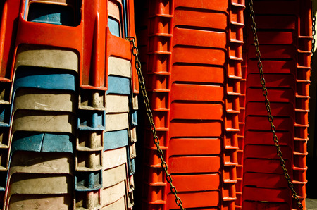 Plastic chairs were being chains. under shining sunlightの写真素材