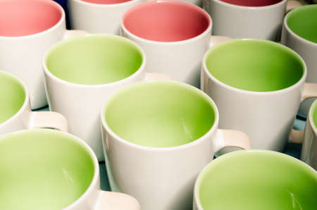 Many two tone color coffee cups, above viewの写真素材