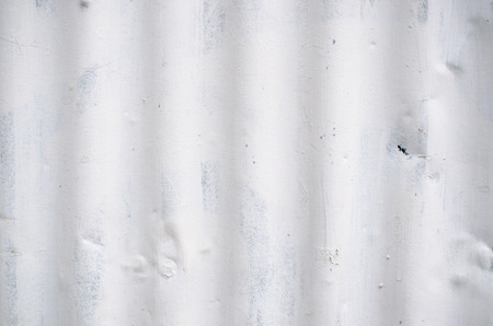 Zinc wall with white cracked paint. texture and backgroundの写真素材