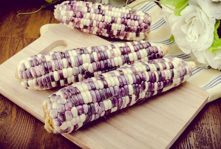 Purple organic corn on wooden backgroundの写真素材