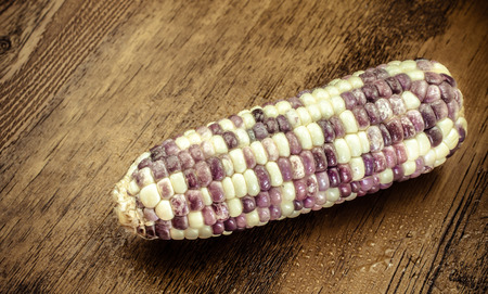 Purple organic corn on wooden backgroundの写真素材