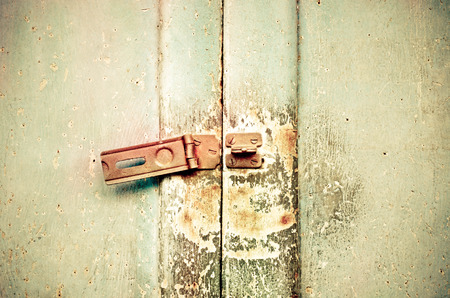 Old rusted lock on a doorの写真素材