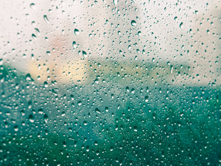 Selective focus and color filter image, Raindrops on glass (raindrops,blur, rain)の写真素材