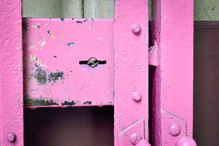 Aged pink padlock of the old sliding door, Selective focus and close upの写真素材