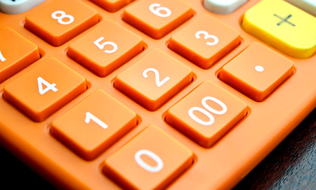 Close up of number button on orange calculator, Color Filtered Photoの写真素材