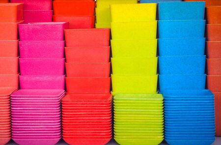 Colorful of ceramic pots background. pink, red, yellow and blueの写真素材