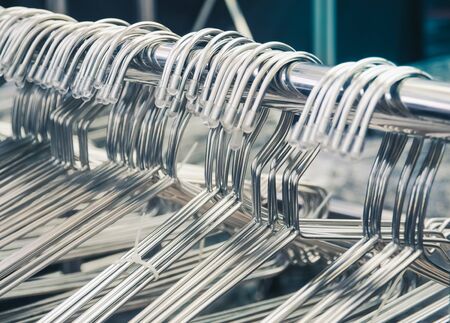 Selective focus and close up/ Group of silver clothes hangers. Fashion concept imageの写真素材